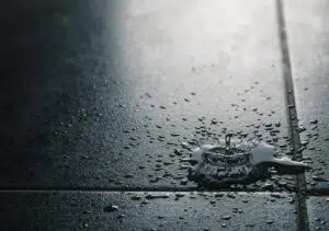 Water drips falling on a water resistant tile flooring.